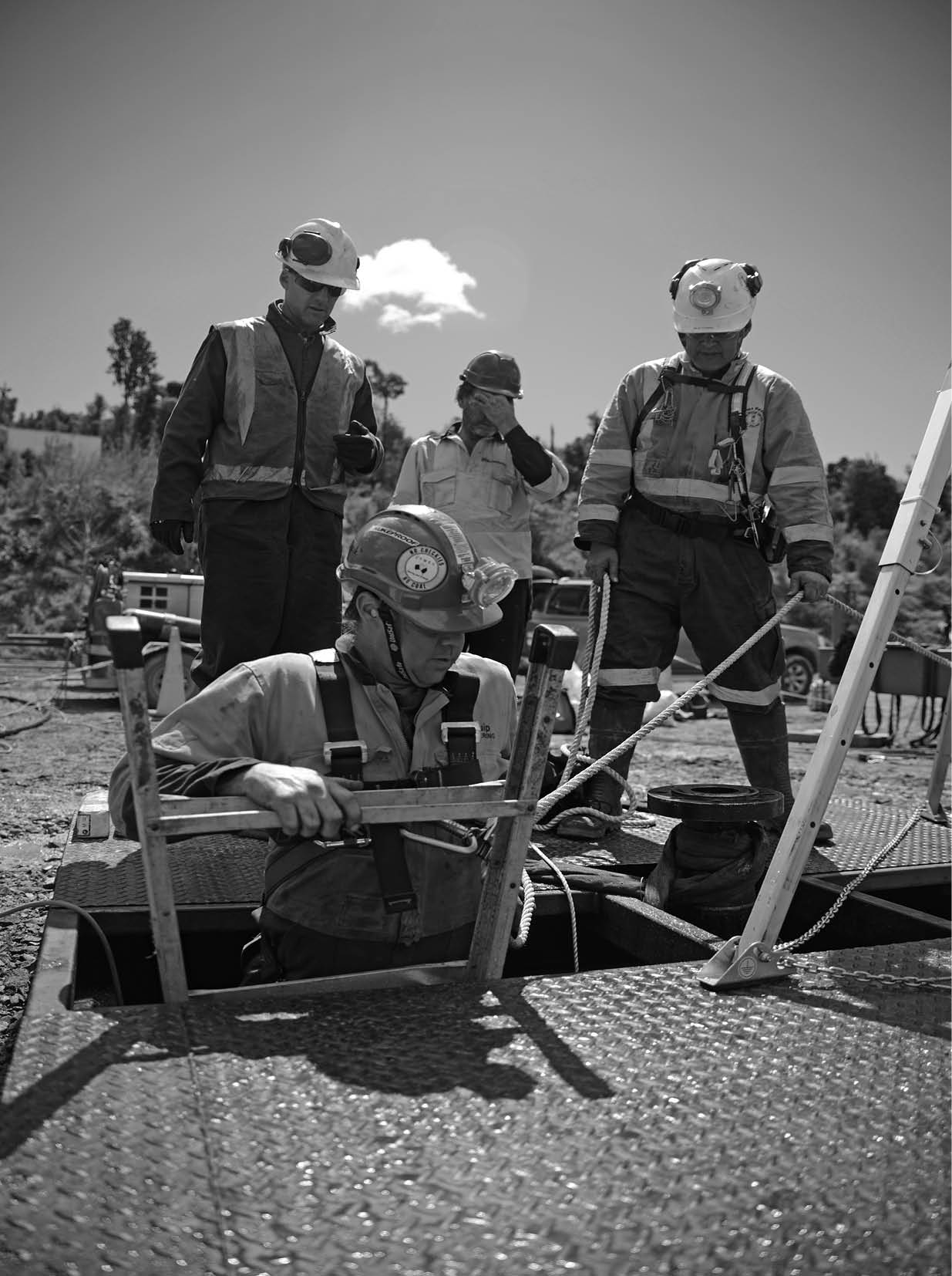 MOANA, NEW ZEALAND, OCTOBER 27, 2017: The safety officer supervises entry into the cellar of an abandoned oil well 