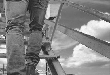 worker, engineering wearing safety shoe with set of safety and security regulation, walking in mind step on the steel gangway bridge at workplace, working in high stage & level of insurance