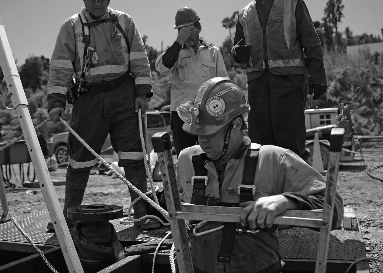 MOANA, NEW ZEALAND, OCTOBER 27, 2017: The safety officer supervises entry into the cellar of an abandoned oil well 