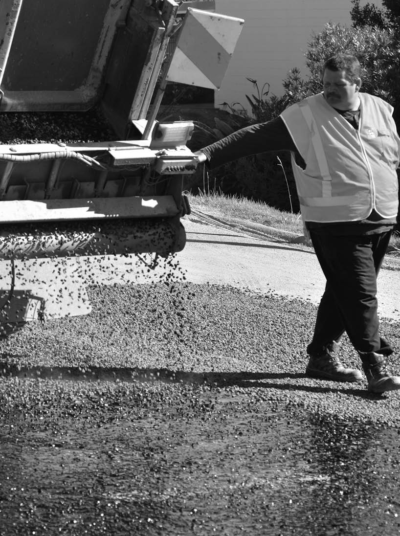 CABLE BAY, NZ - APR 01 2014:Road worker during roadwork The Road Maintenance crew has the responsibility for the day-to-day maintenance needs of the road