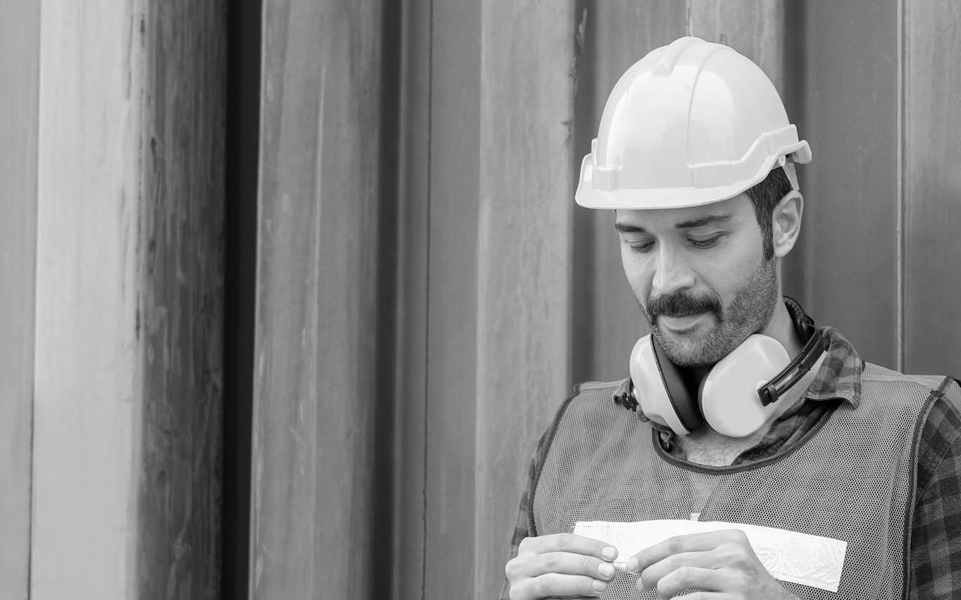 Factory worker with a cigarette smoke break, Labour takes a cigarette break